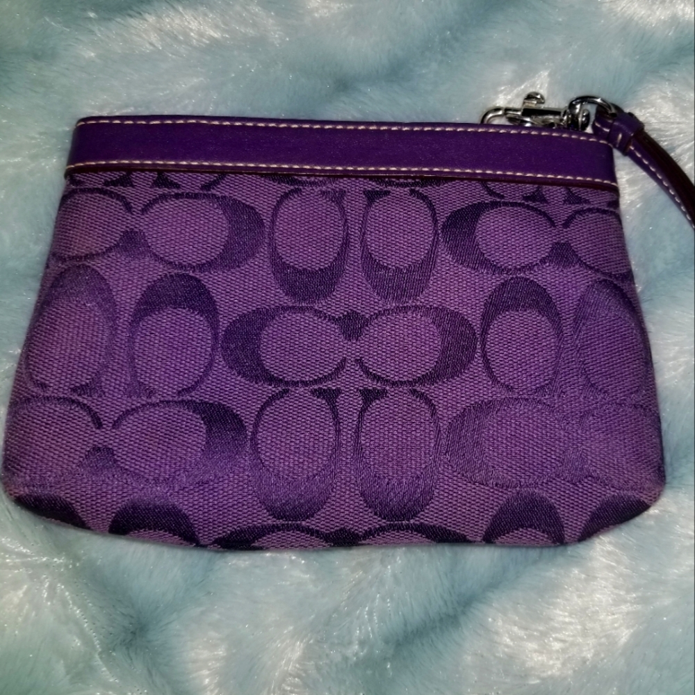 COACH signature wristlet in plum size:5"height 7"width 7.5" drop